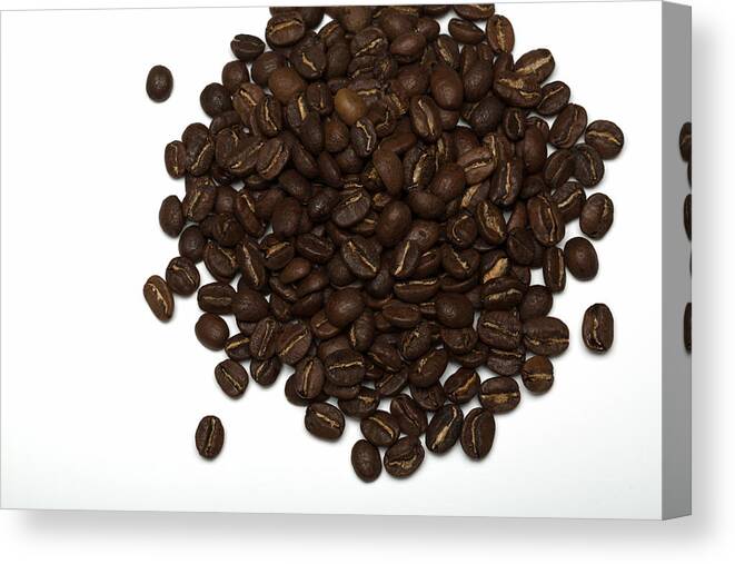White Background Canvas Print featuring the photograph Pile of Coffee beans on a white background by Jean-Marc PAYET