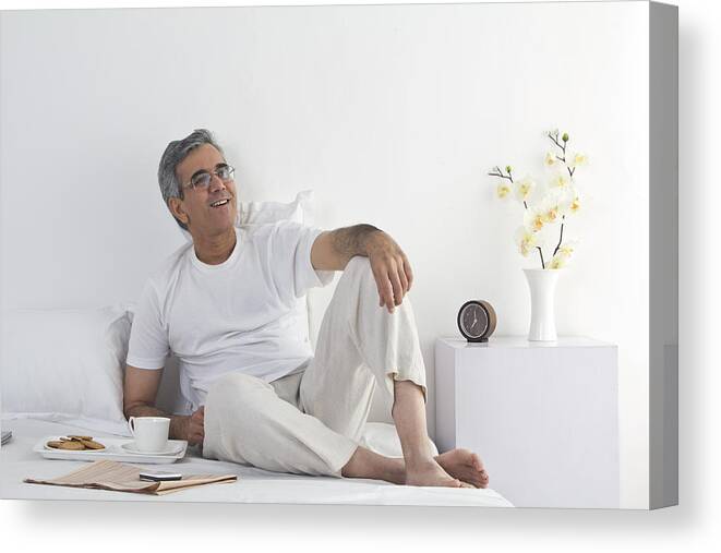 Mature Adult Canvas Print featuring the photograph Portrait of a man relaxing by Sudipta Halder