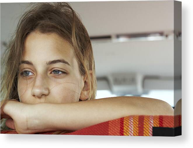 Car Interior Canvas Print featuring the photograph Portrait of serious teenage girl inside car by Westend61