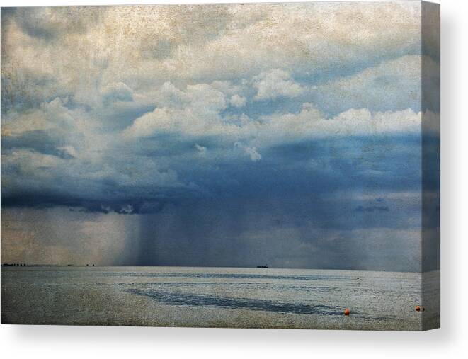 Sea Canvas Print featuring the photograph Rainy day by Yasmina Baggili