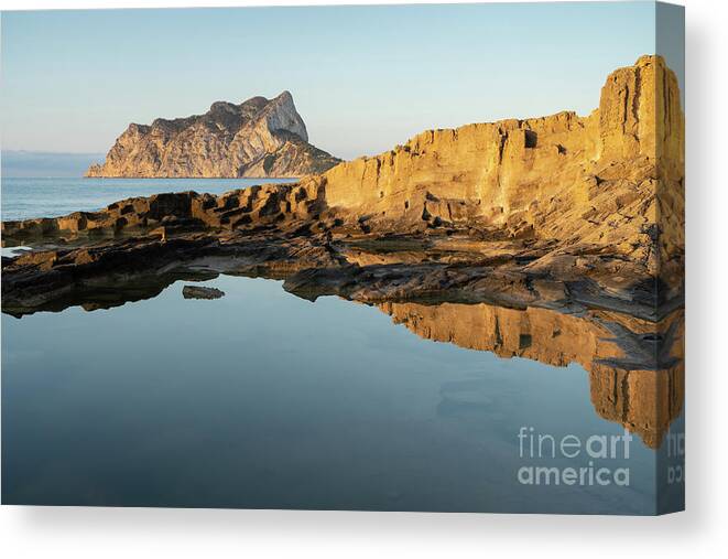 Mediterranean Canvas Print featuring the photograph Reflection of rocks in the calm Mediterranean Sea at sunrise 2 by Adriana Mueller