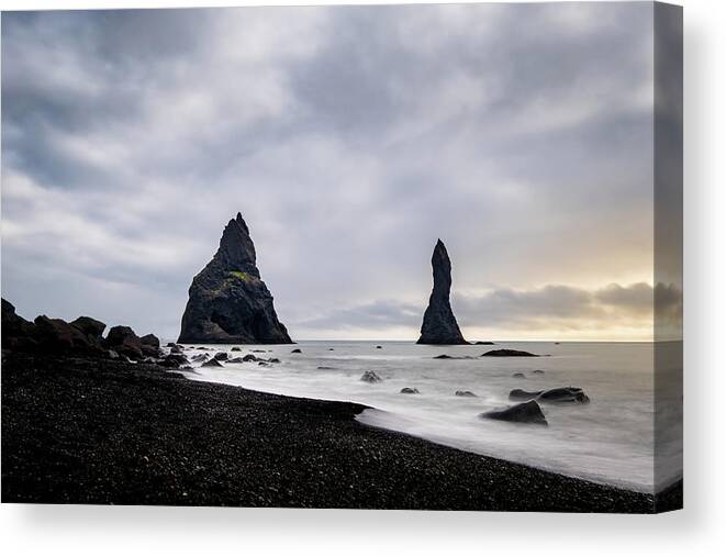 Reynisfjara Canvas Print featuring the photograph Reynisfjara black sand beach and Reynisdrangar in Iceland by Alexios Ntounas