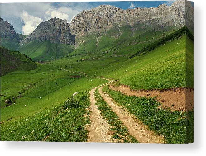 Mountain Canvas Print featuring the photograph Road in mountains by Mikhail Kokhanchikov