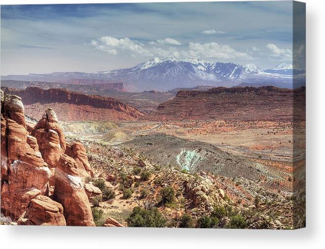 Arches Canvas Print featuring the photograph Road Trip -La Sal range from Fiery Furnace overlook at Arches National Park in Utah near Moab by Peter Herman