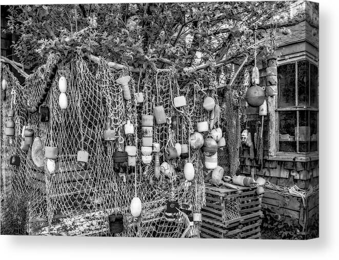 Bradley Wharf Canvas Print featuring the photograph Rockport Fishing Net And Buoys BW by Susan Candelario