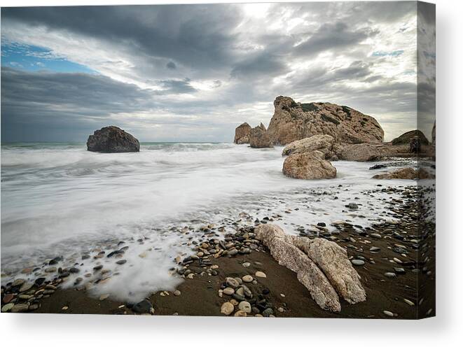 Seascape Canvas Print featuring the photograph Seascape with windy waves splashing at the rocky coastal area. by Michalakis Ppalis
