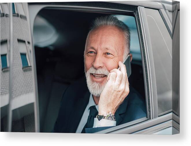 Corporate Business Canvas Print featuring the photograph Senior businessman using phone in business car by RgStudio