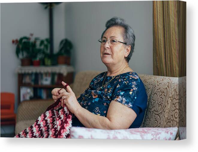 Working Canvas Print featuring the photograph Senior Woman Knitting by Hsyncoban