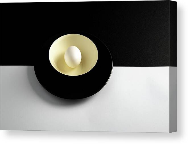 Still-life Canvas Print featuring the photograph Single fresh white egg on a yellow bowl by Michalakis Ppalis