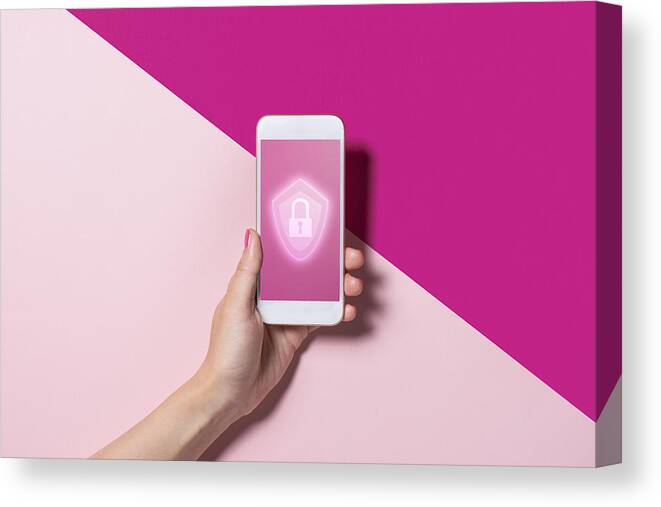 Shadow Canvas Print featuring the photograph Smart phone with the security key lock icon by Yagi Studio