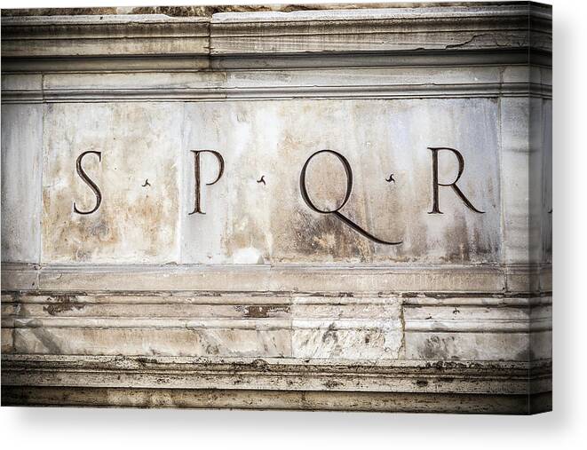 Rome Canvas Print featuring the photograph SPQR engraved on stone in Rome, Italy by Fabiano Di Paolo