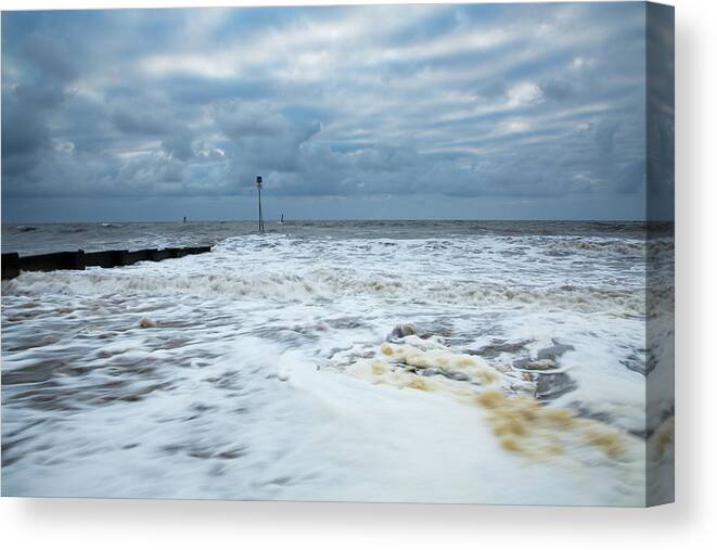 Hunstanton Canvas Print featuring the photograph Stormy weather at Hunstanton beach by Ian Middleton