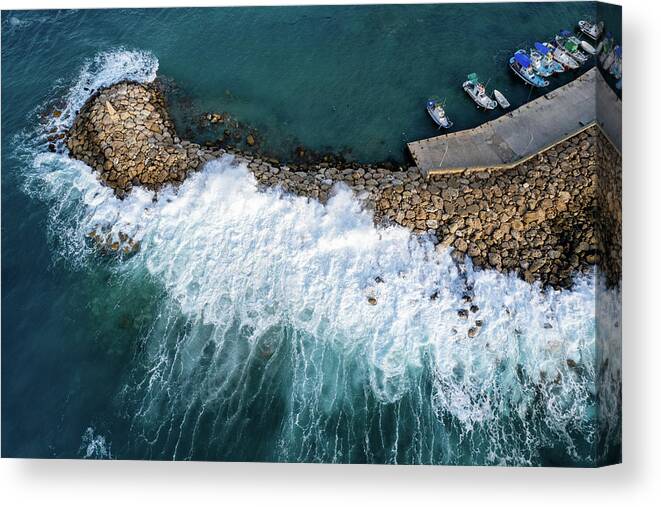 Brakewater Canvas Print featuring the photograph Stormy windy waves on the shore. Drone photography. by Michalakis Ppalis