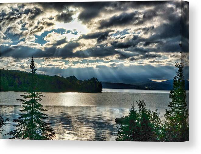 Sun Canvas Print featuring the photograph Sun Rays and Storm Clouds Over Rangeley Maine by Russel Considine