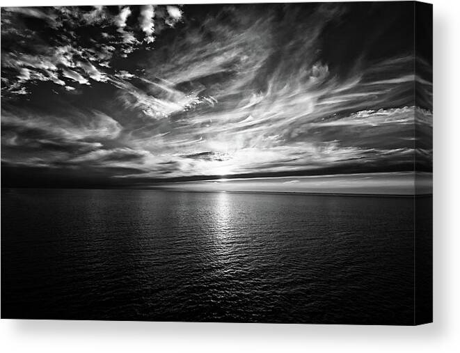 Sunset Canvas Print featuring the photograph Sunset on the horizon at sea by Bernhard Schaffer