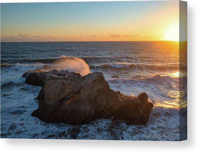 Beach Sunset Canvas Print featuring the photograph Sunset Over the Bird Rock by Matthew DeGrushe