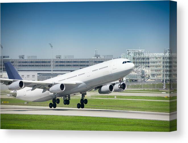 Taking Off Canvas Print featuring the photograph Taking Off by Bkindler