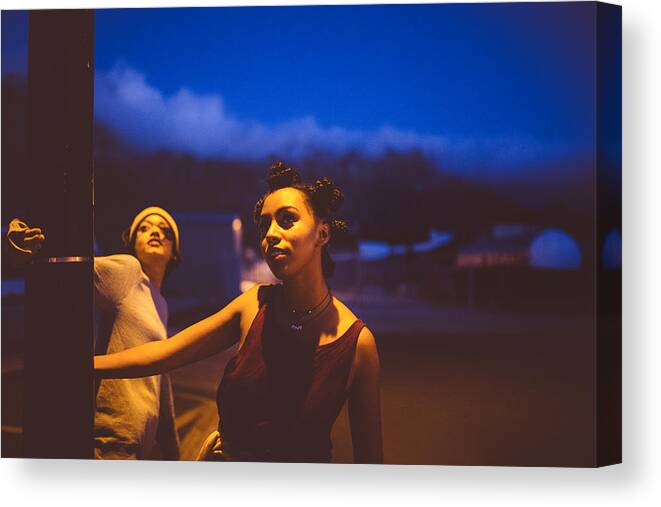 Orange Color Canvas Print featuring the photograph Teen grunge girls hanging out under a street light by Wundervisuals
