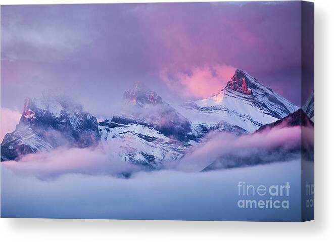 Rocky Mountains Canvas Print featuring the photograph The Three Sisters peaks at Sunrise, Canmore, Alberta, Canada by Neale And Judith Clark