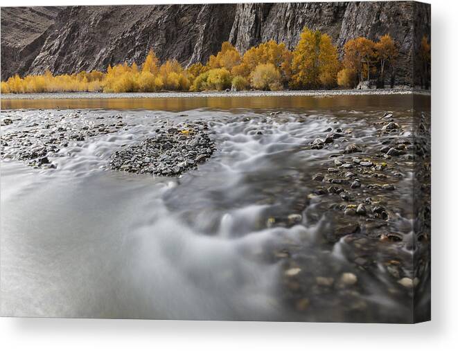 Water's Edge Canvas Print featuring the photograph Time lapse view of river and rocky riverbed in remote landscape by Jeremy Woodhouse