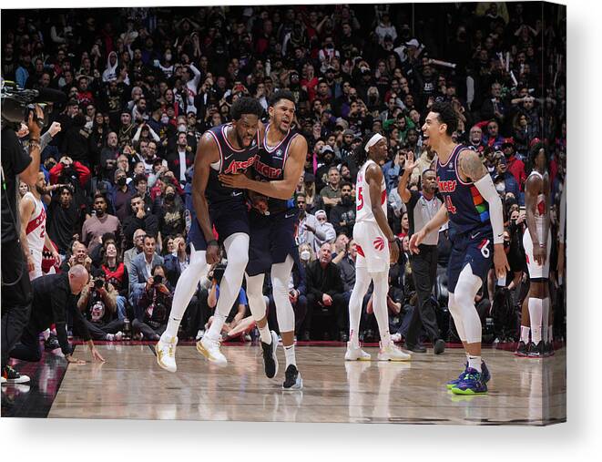 Joel Embiid Canvas Print featuring the photograph Tobias Harris and Joel Embiid by Mark Blinch
