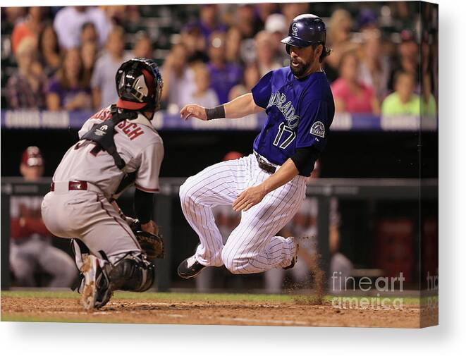 Baseball Catcher Canvas Print featuring the photograph Todd Helton and Jordan Pacheco by Doug Pensinger