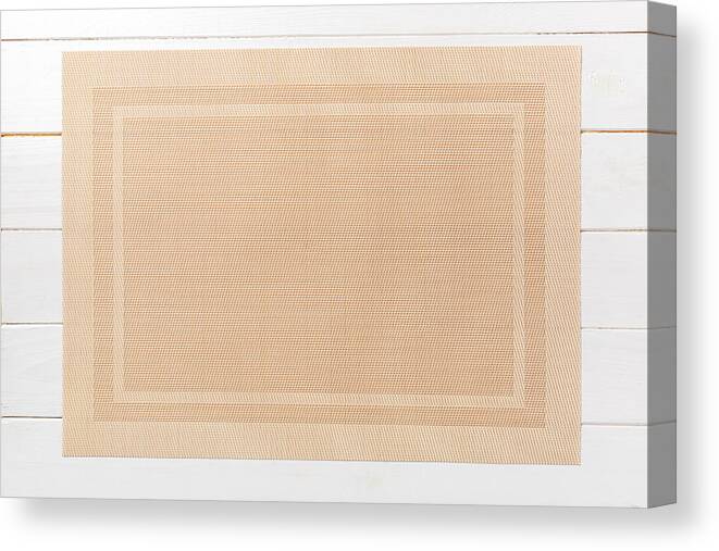 Chinese Culture Canvas Print featuring the photograph Top view of brown place mat for a dish. Wooden background with empty space for your design by Mykola Sosiukin