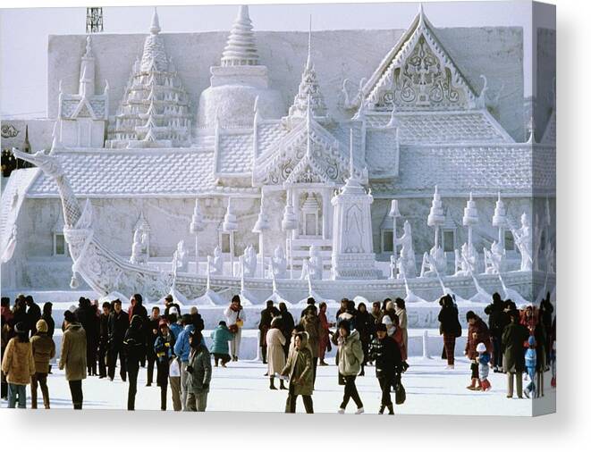 Three Quarter Length Canvas Print featuring the photograph Tourist in front of a snow sculpture, Bangkok's Royal Palace, Snow Festival, Sapporo, Japan by Glowimages