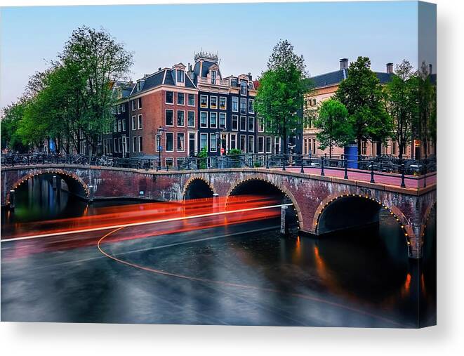 Canal Canvas Print featuring the photograph Trail Light In Amsterdam by Manjik Pictures