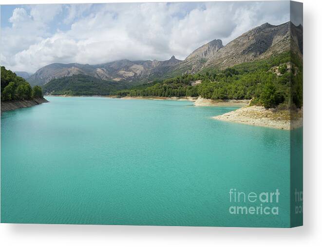 Guadalest Canvas Print featuring the photograph Turquoise blue water and mountain landscape by Adriana Mueller