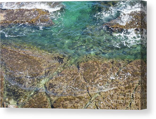 Turquoise Canvas Print featuring the photograph Turquoise Blue Water And Rocks On The Coast by Adriana Mueller