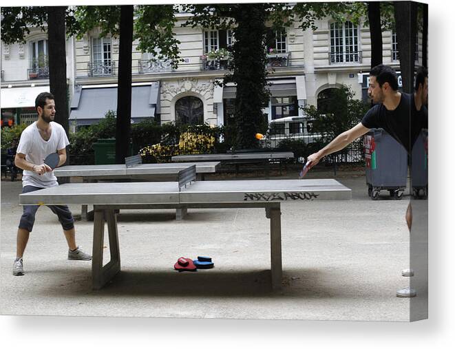 People Canvas Print featuring the photograph Two Men Play Ping Pong in Paris Park by Photo by Doug Oakley