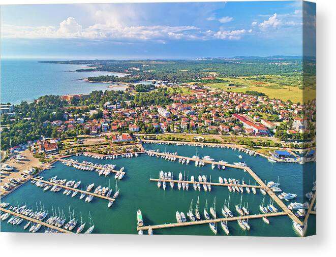 Umag Canvas Print featuring the photograph Umag. Aerial view of sailing marina and beautiful coastlne in Um by Brch Photography
