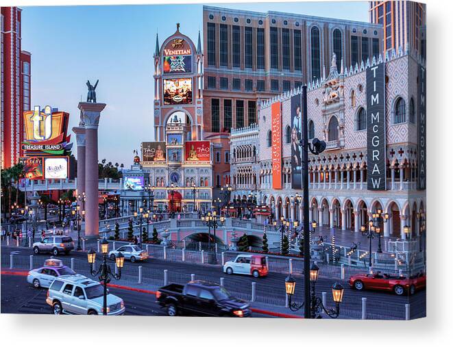 The Venetian Las Vegas Canvas Print featuring the photograph Venetian on Las Vegas Strip at dusk by Tatiana Travelways