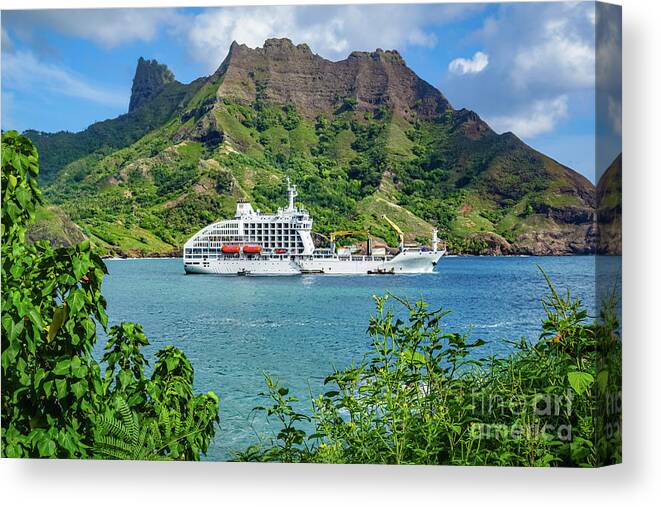 Freighter Canvas Print featuring the photograph Vessel anchored in Puamau Bay, Hiva Oa, Marquesas Islands by Lyl Dil Creations