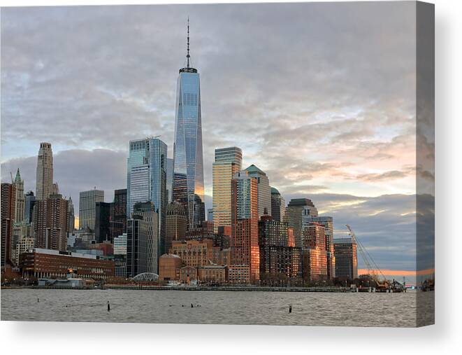 Downtown District Canvas Print featuring the photograph View at Downtown Manhattan with One World Trade Center at dusk by Rainer Grosskopf