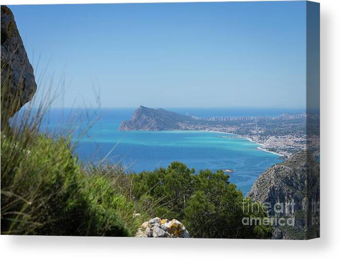 Spain Canvas Print featuring the photograph View of the coast and the Mediterranean sea in Benidorm by Adriana Mueller
