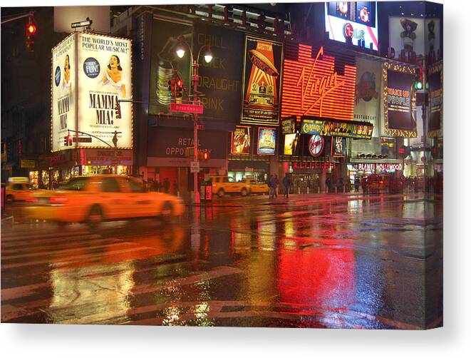Blurred Motion Canvas Print featuring the photograph View of Times Square on rainy winter evening by Piccell