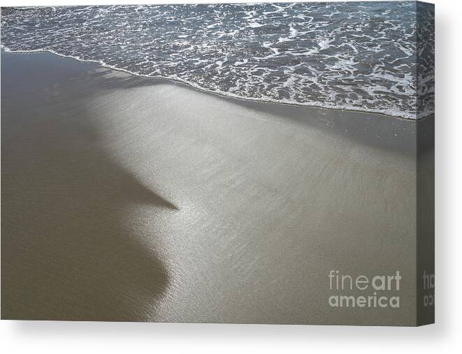 Sandy Beach Canvas Print featuring the photograph Wet sand, sea water and reflections of sunlight by Adriana Mueller