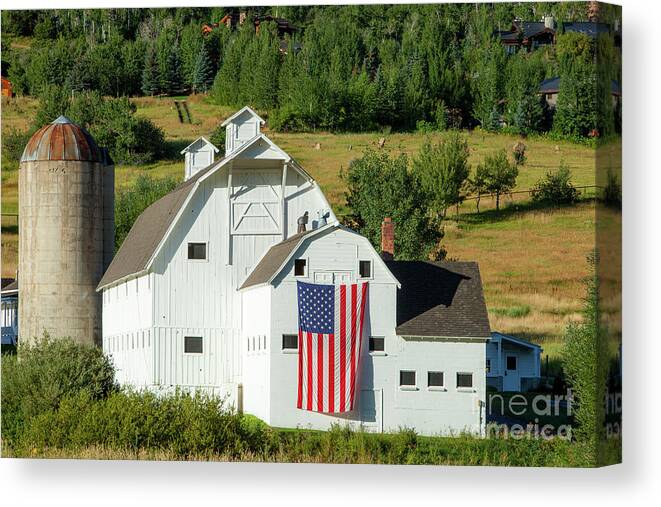 White Barn Canvas Print featuring the photograph White Barn - American Flag - Utah by Brian Jannsen