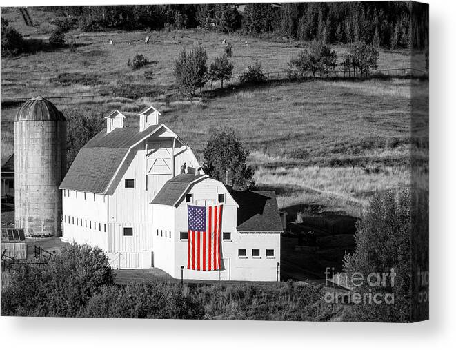White Barn Canvas Print featuring the photograph White Barn with American Flag - Horizontal by Brian Jannsen