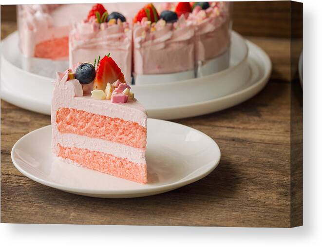 Food Canvas Print featuring the photograph White chocolate strawberry yogurt cake decorated with fresh fruits and chocolate chunk on wood table. Delicious and sweet pink cake for Valentines or birthday party. Homemade bakery concept. by October22