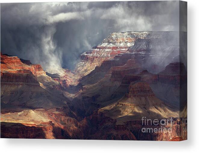 Arizona Canvas Print featuring the photograph Winter Snow Shower Passing Through Grand Canyon National Park by Tom Schwabel