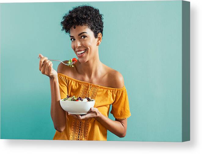 People Canvas Print featuring the photograph Woman eating salad by Ridofranz