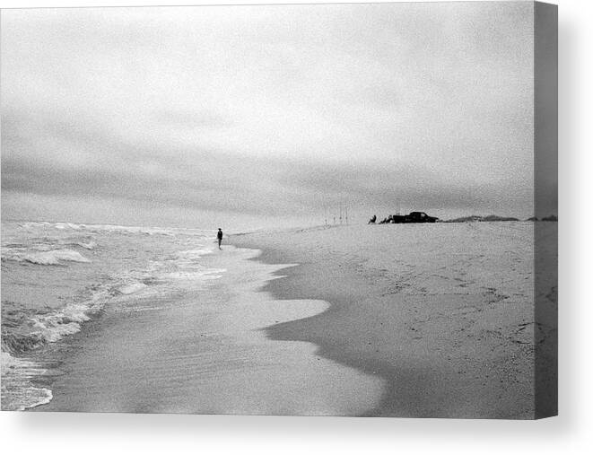 Island Beach State Park Canvas Print featuring the photograph Woman Walking Along the Shore, by Stephen Russell Shilling