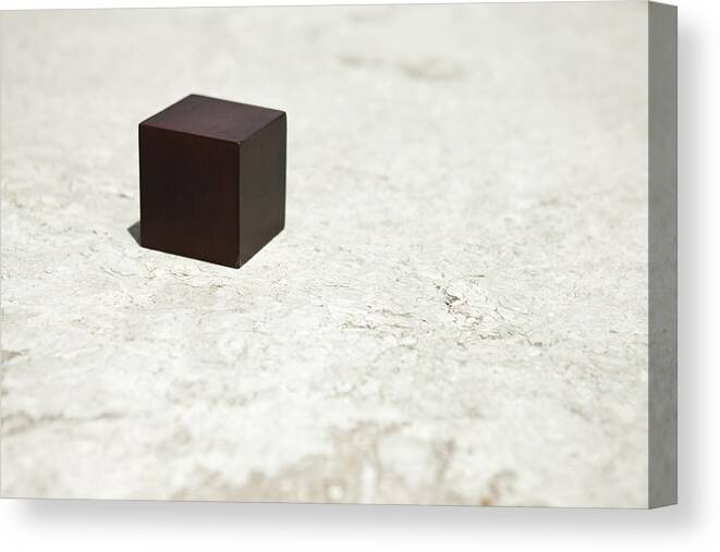 Réunion Canvas Print featuring the photograph Wooden cube by PhotoAlto/Sandro Di Carlo Darsa
