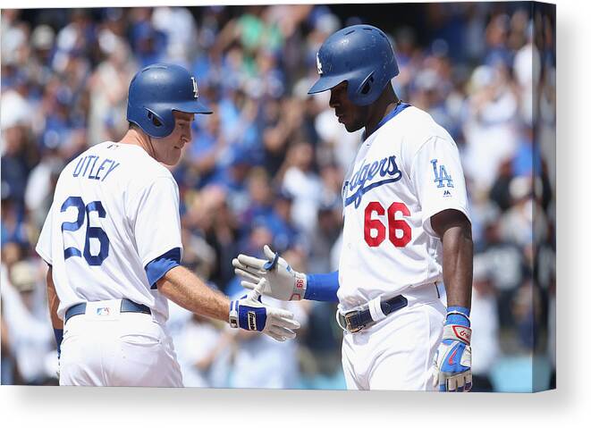 Scoring Canvas Print featuring the photograph Yasiel Puig and Chase Utley by Stephen Dunn