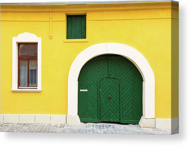 Arch Canvas Print featuring the photograph Yellow facade of old house by Viktor Wallon-Hars