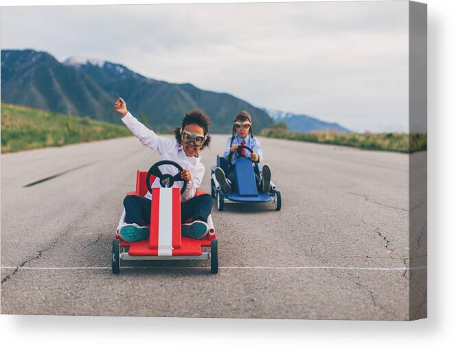 Human Arm Canvas Print featuring the photograph Young Business Girl Beats Boy in Car Race by RichVintage
