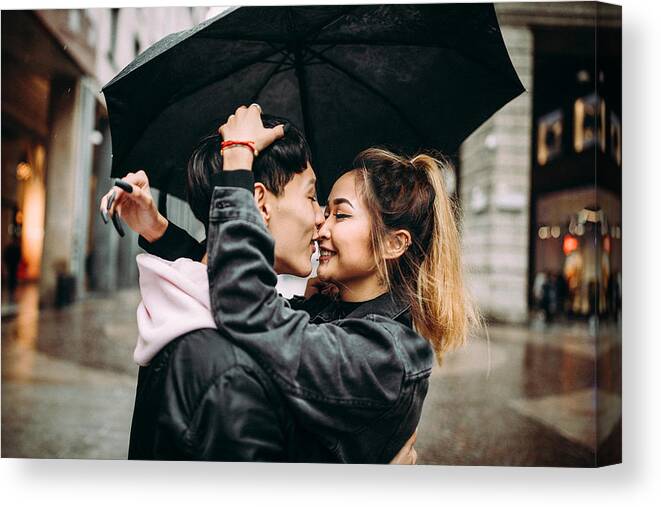 Boyfriend Canvas Print featuring the photograph Young fashion lovers at beginning of love story by Pekic